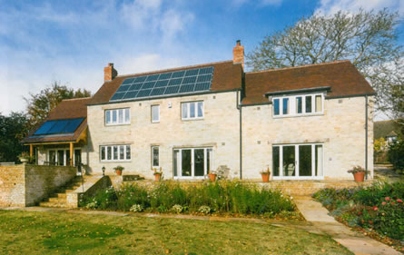 A new eco self-build home with solar PV, a ground source heat pump and flat panel solar thermal system integrated by an Ecocat thermal store cylinder.