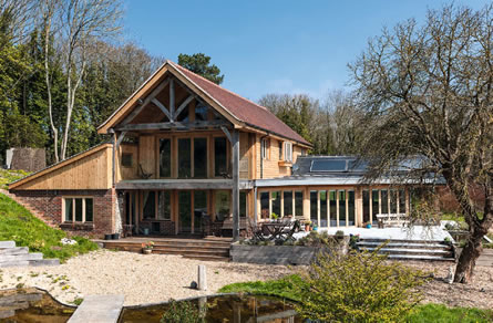 A new eco self-build home with an air source heat pump and flat panel solar thermal system connected by an Ecocat thermal store cylinder.